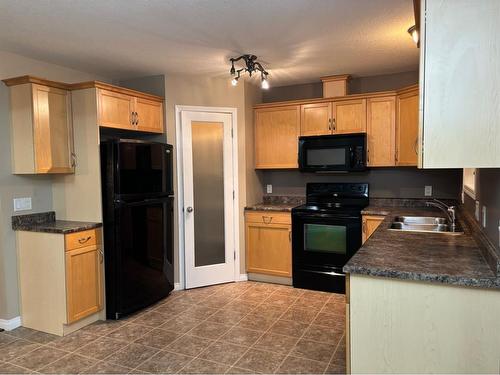 Unit 3-4010 47 Street, Whitecourt, AB - Indoor Photo Showing Kitchen With Double Sink