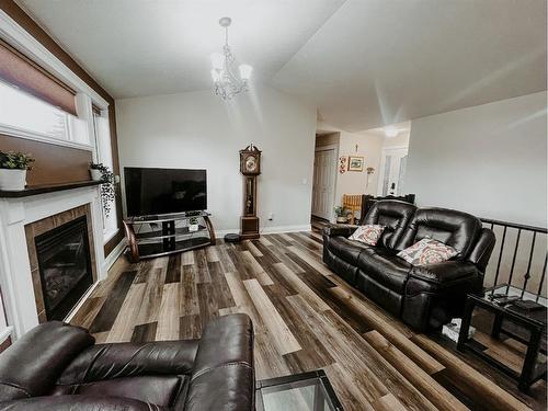 66 Cedar Heights, Whitecourt, AB - Indoor Photo Showing Living Room With Fireplace