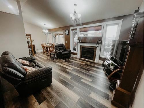 66 Cedar Heights, Whitecourt, AB - Indoor Photo Showing Living Room With Fireplace