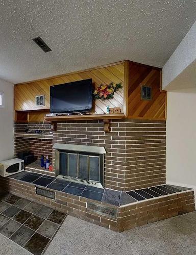 1102 55 Street, Edson, AB - Indoor With Fireplace