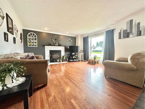 812 9 Avenue, Fox Creek, AB - Indoor Photo Showing Living Room With Fireplace