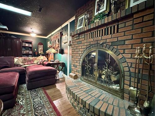 17 Hillside Avenue, Swan Hills, AB - Indoor Photo Showing Other Room With Fireplace