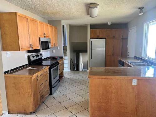 10857 98 Avenue, Grande Cache, AB - Indoor Photo Showing Kitchen With Double Sink