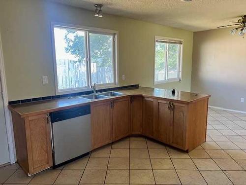 10857 98 Avenue, Grande Cache, AB - Indoor Photo Showing Kitchen With Double Sink