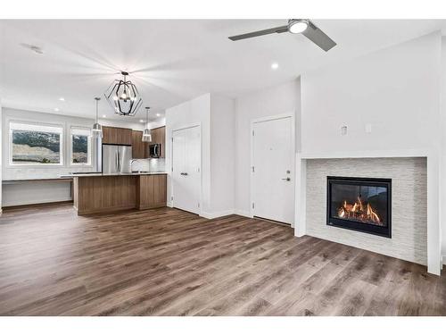 201F-209 Stewart Creek Rise, Canmore, AB - Indoor With Fireplace