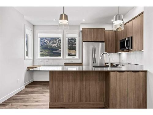 201F-209 Stewart Creek Rise, Canmore, AB - Indoor Photo Showing Kitchen