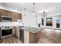 201F-209 Stewart Creek Rise, Canmore, AB  - Indoor Photo Showing Kitchen With Upgraded Kitchen 