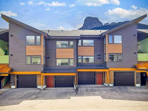 201F-209 Stewart Creek Rise, Canmore, AB - Outdoor With Facade