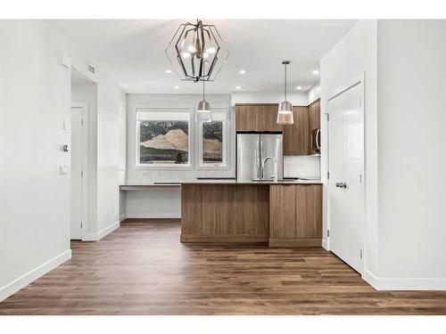 201F-209 Stewart Creek Rise, Canmore, AB - Indoor Photo Showing Kitchen