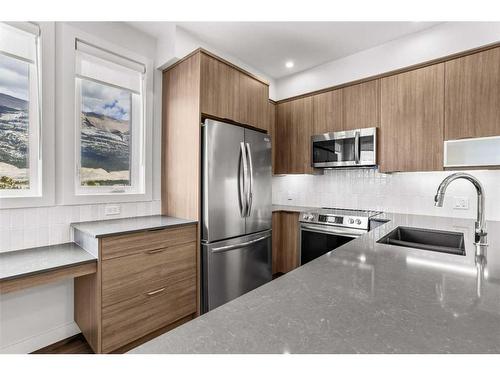 201F-209 Stewart Creek Rise, Canmore, AB - Indoor Photo Showing Kitchen With Upgraded Kitchen