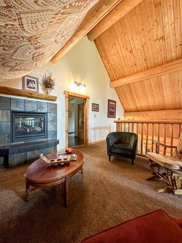 26 124062 Township Road 593A, Rural Woodlands County, AB - Indoor Photo Showing Living Room With Fireplace