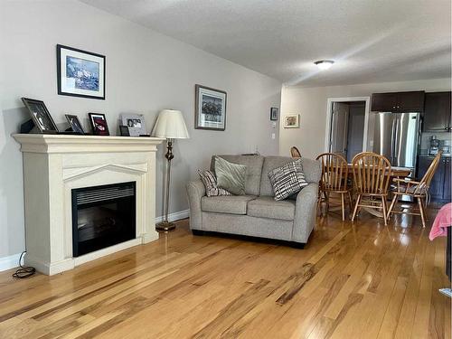 207-5037 7 Avenue, Edson, AB - Indoor Photo Showing Living Room With Fireplace