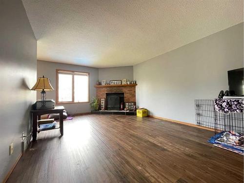 107 Assiniboine Drive, Swan Hills, AB - Indoor Photo Showing Living Room With Fireplace