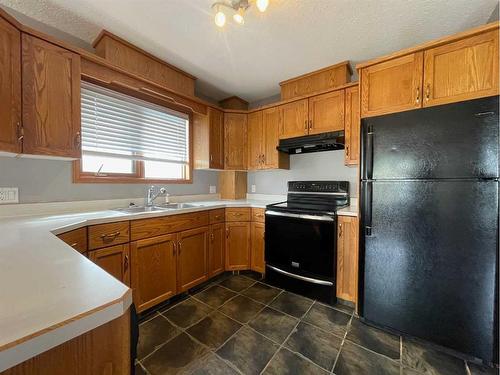 107 Assiniboine Drive, Swan Hills, AB - Indoor Photo Showing Kitchen With Double Sink