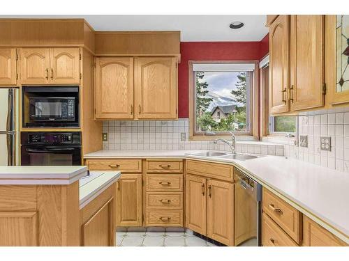 1102 10Th Avenue, Canmore, AB - Indoor Photo Showing Kitchen With Double Sink