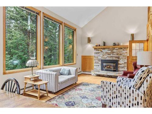 1102 10Th Avenue, Canmore, AB - Indoor Photo Showing Living Room With Fireplace