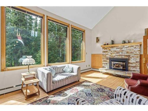 1102 10Th Avenue, Canmore, AB - Indoor Photo Showing Living Room With Fireplace