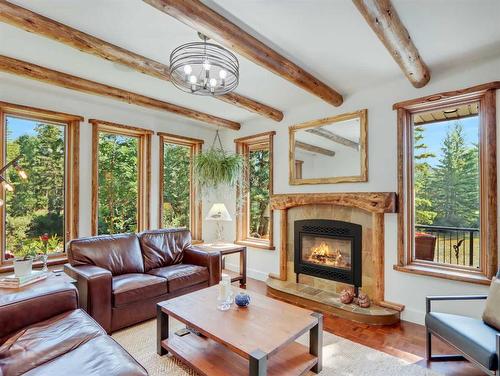 Creekside - 1-701 Mallard Alley, Canmore, AB - Indoor Photo Showing Living Room With Fireplace