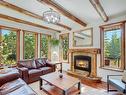 Creekside - 1-701 Mallard Alley, Canmore, AB  - Indoor Photo Showing Living Room With Fireplace 