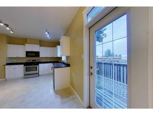 109-116 6 Avenue Ne, Slave Lake, AB - Indoor Photo Showing Kitchen