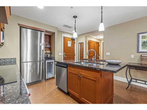 305-191 Kananaskis Way, Canmore, AB - Indoor Photo Showing Kitchen With Stainless Steel Kitchen With Double Sink