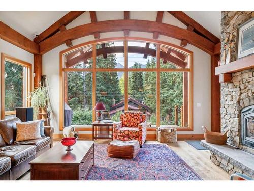 517 4Th Street, Canmore, AB - Indoor Photo Showing Living Room With Fireplace