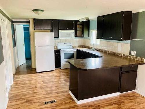 12-113040 Township Road 592, Rural Woodlands County, AB - Indoor Photo Showing Kitchen With Double Sink