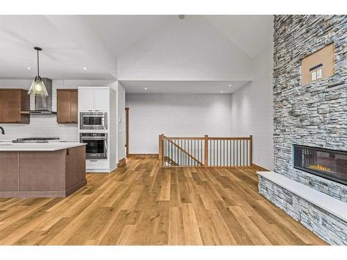 1308 Three Sisters Parkway, Canmore, AB - Indoor Photo Showing Kitchen With Fireplace