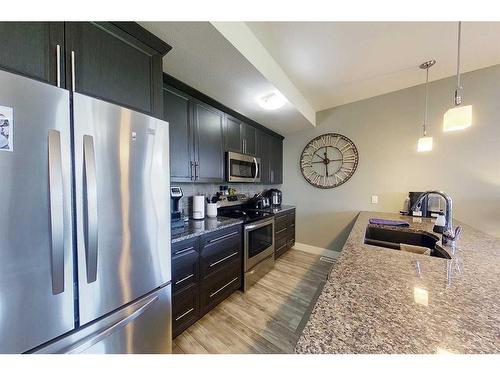 104-605 6 Avenue Se, Slave Lake, AB - Indoor Photo Showing Kitchen With Stainless Steel Kitchen With Double Sink With Upgraded Kitchen