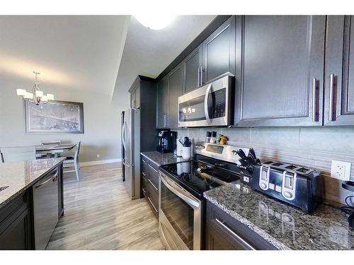 104-605 6 Avenue Se, Slave Lake, AB - Indoor Photo Showing Kitchen With Stainless Steel Kitchen With Upgraded Kitchen