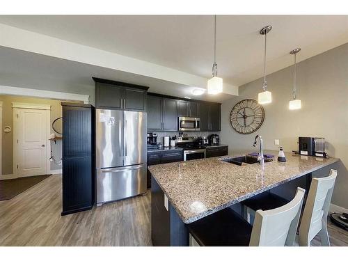 104-605 6 Avenue Se, Slave Lake, AB - Indoor Photo Showing Kitchen With Stainless Steel Kitchen With Double Sink With Upgraded Kitchen