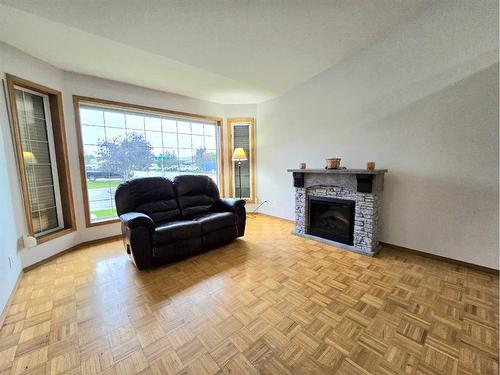 2 Allan Crescent, Whitecourt, AB - Indoor Photo Showing Living Room With Fireplace