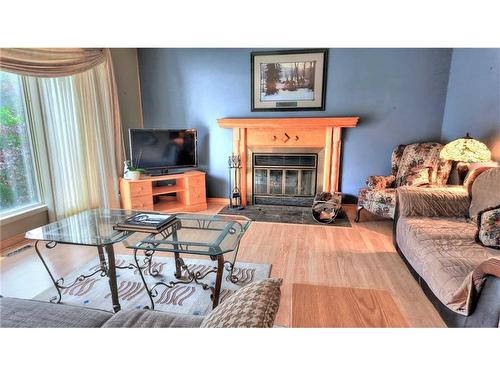 319 Silvertip Close, Canmore, AB - Indoor Photo Showing Living Room With Fireplace