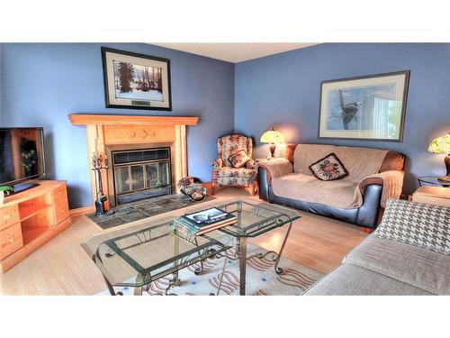 319 Silvertip Close, Canmore, AB - Indoor Photo Showing Living Room With Fireplace