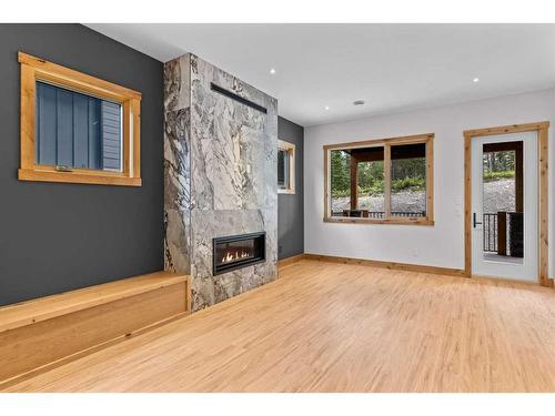 236 Stewart Creek Rise, Canmore, AB - Indoor Photo Showing Living Room With Fireplace