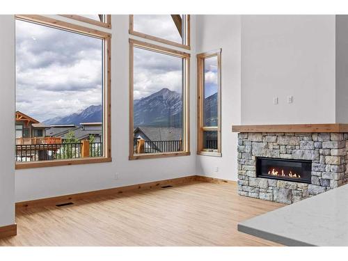 236 Stewart Creek Rise, Canmore, AB - Indoor Photo Showing Living Room With Fireplace