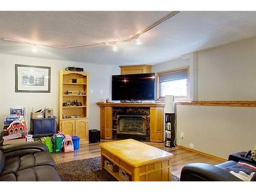 604 2 Avenue Nw, Slave Lake, AB - Indoor Photo Showing Living Room With Fireplace