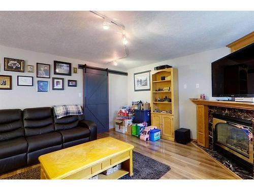 604 2 Avenue Nw, Slave Lake, AB - Indoor Photo Showing Living Room With Fireplace