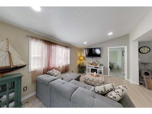 601 1A Avenue Sw, Slave Lake, AB - Indoor Photo Showing Living Room With Fireplace