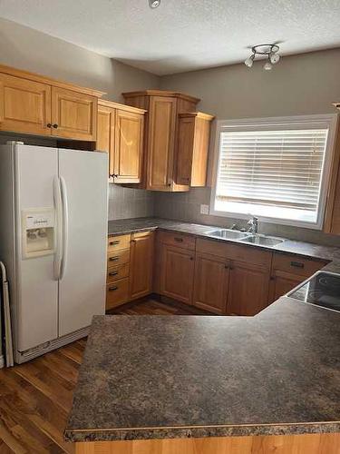 14-9 Leedy Drive, Whitecourt, AB - Indoor Photo Showing Kitchen With Double Sink