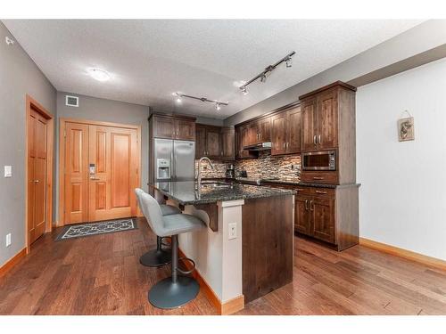 316-106 Stewart Creek Landing, Canmore, AB - Indoor Photo Showing Kitchen