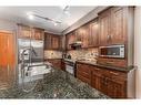 316-106 Stewart Creek Landing, Canmore, AB  - Indoor Photo Showing Kitchen With Double Sink 