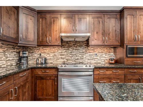 316-106 Stewart Creek Landing, Canmore, AB - Indoor Photo Showing Kitchen With Upgraded Kitchen