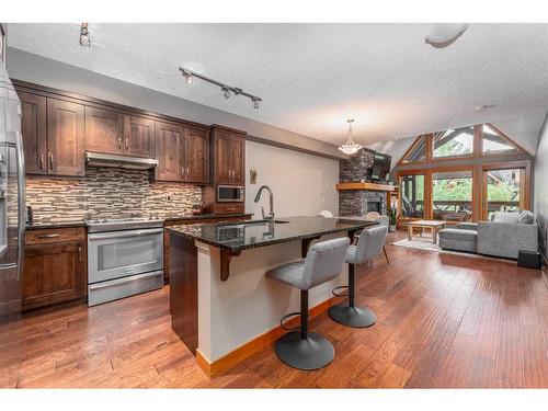 316-106 Stewart Creek Landing, Canmore, AB - Indoor Photo Showing Kitchen With Stainless Steel Kitchen With Upgraded Kitchen