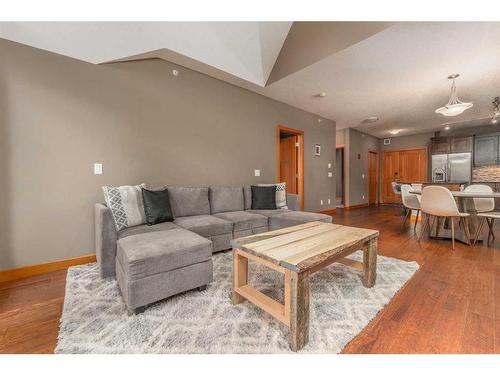 316-106 Stewart Creek Landing, Canmore, AB - Indoor Photo Showing Living Room