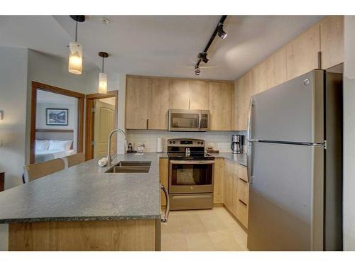 213-190 Kananaskis Way, Canmore, AB - Indoor Photo Showing Kitchen With Double Sink