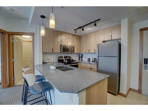 213-190 Kananaskis Way, Canmore, AB - Indoor Photo Showing Kitchen With Double Sink