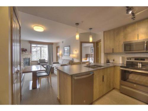 213-190 Kananaskis Way, Canmore, AB - Indoor Photo Showing Kitchen With Double Sink