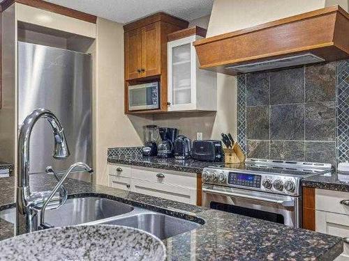 224-173 Kananaskis Way, Canmore, AB - Indoor Photo Showing Kitchen With Double Sink With Upgraded Kitchen