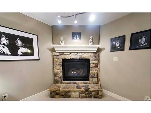 910 62 Street, Edson, AB - Indoor Photo Showing Living Room With Fireplace